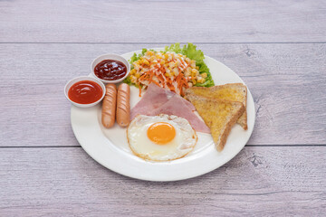 Delicious breakfast or lunch with fried eggs and sausage