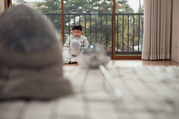 Before the tournament day, a boy dressed in fencing gear are rehearsing in gym