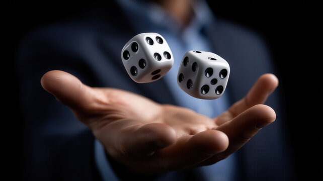 Businessman in suit tossing two white dice into air with dark background, symbolizing chance and risk taking - Powered by Adobe