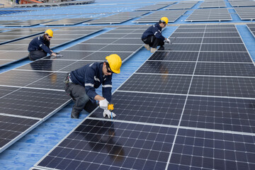 Engineer repair solar panel on the factory rooftop