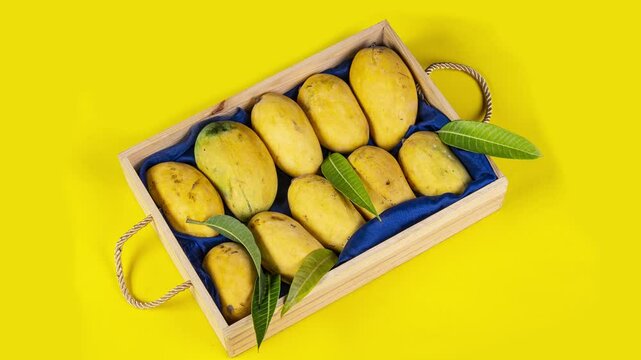 Chaunsa Mango wooden baset on yellow video 4k