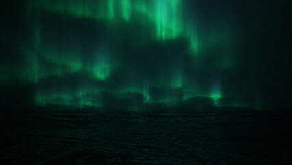 Northern Lights Over Dark Ocean at Night