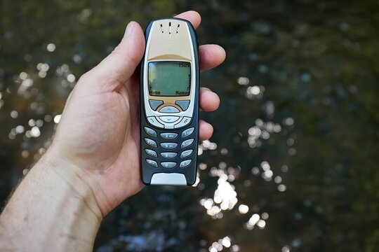 Old mobile phone outdoors with buttons