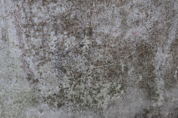 Closeup of a weathered concrete wall with texture and imperfections