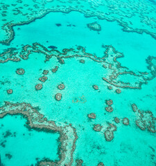 Aerial view of underwater reefs and Heart Reef of the Great Barrier Reef, the world's largest coral...