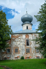 Nikolo-Medvedsky Monastery in Novaya Ladoga. It is located next to the Cathedral of the Nativity of the Blessed Virgin Mary. Tourists are exploring the attraction.