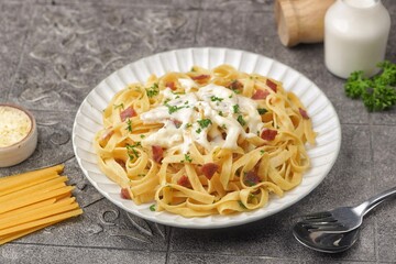 Fettuccine carbonara is a creamy pasta sauce made from a mixture of cream, cheese, and eggs.