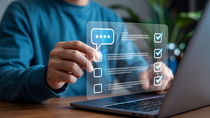 Man interacts with digital checklist on laptop, marking tasks as complete for increased productivity