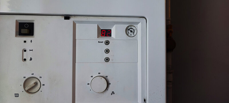 Gas Boiler Control Panel with Error Code E1. Heating System Maintenance, Utility Technology, Home Appliance