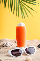 Sunblock or sunscreen in cosmetic tube on beach sand and beige background. Summer vacation and skin care concept with starfish and sea shells, spf uv-protect cosmetics. Skin health. High quality photo