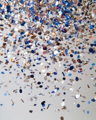 Obraz premium Falling blue & silver confetti, celebratory atmosphere