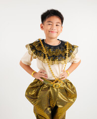 Portrait of Thailand kid boy smiling traditional Thai dress costume stand akimbo gesture in studio shot isolated white background, Happy primary child standing on waist support