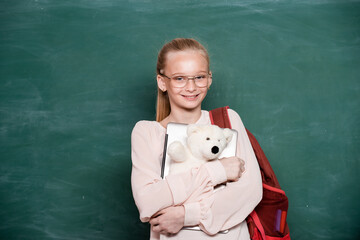 School teen girl. School and students in classroom. Education kids. Child pupil student in the school class. Studying and learning concept.