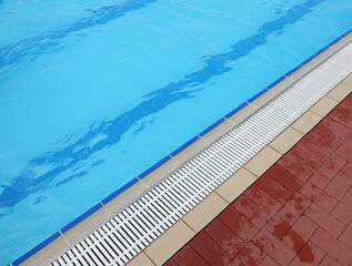 pool water and the edge of the pool without people water as a space to insert a personalized text...