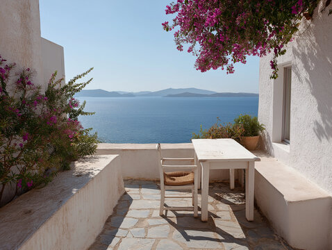 Intimate dining terrace overlooks endless ocean vistas surrounded by lush purple flowering plants.