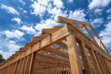 Wooden house frame construction against blue sky wooden frame