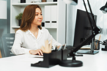 Portrait of beautiful businesswoman working on computer for checking email for sales report highest profit in casual day at modern office in young making startup business challenge concept. Infobahn.
