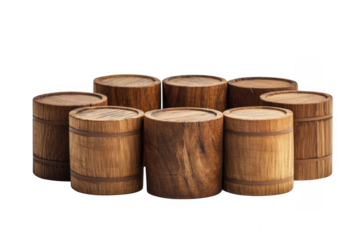 Group of small wooden barrels arranged in a circle on a black background