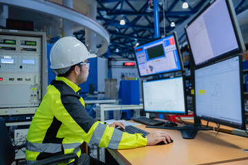 Engineer working at control room,Manager control system,Technician man monitoring program from a...