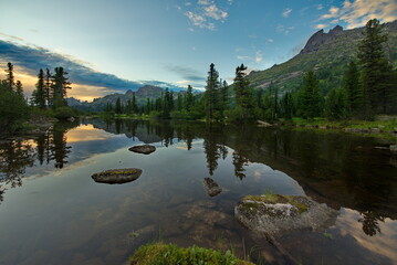 Russia. Krasnoyarsk Territory, Eastern Sayans. Summer evening on the shore of the Azure mountain lake in the natural mountain park Ergaki.
