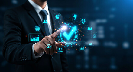 Businessman pointing at a glowing checkmark surrounded by data icons in a digital interface
