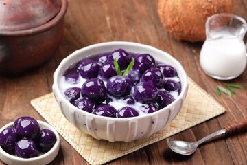 Biji Salak Ubi Ungu. Purple sweet potato salak seeds are a ball-shaped snack made from a mixture of starch and sweet potato