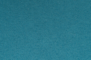 Textured solid fabric in vibrant teal color suitable for various design projects