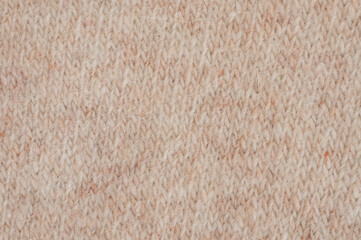 Knitted fabric with soft texture in warm beige color suitable for winter wear