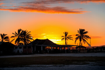 Sunrise over a paradise beach with palm trees, Coche Island, Venezuela. Morning on a paradise beach.