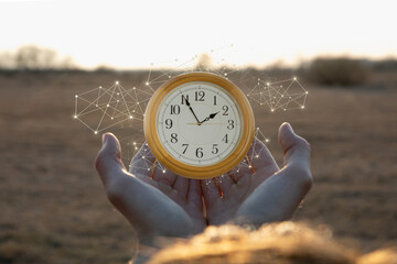 Holding time in hands with a glowing clock display
