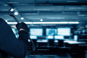 Intruder with a crowbar in a dark office space