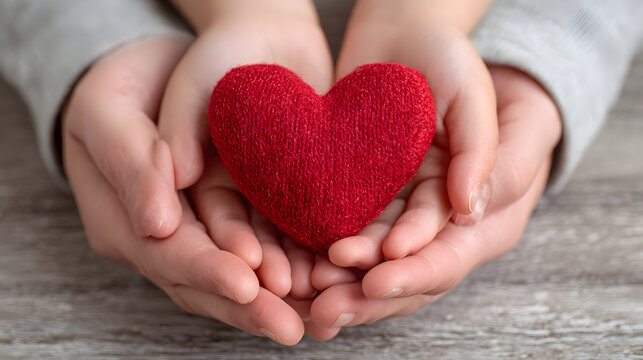 adult and child hands holding red heart, health care, love and family insurance concept, world heart day, world health day, adoption foster family, international day of families