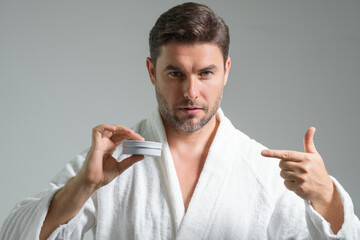 Aged care. Sexy bearded man care of skin. Unshaven man with bristle and perfect skin. Male beauty...