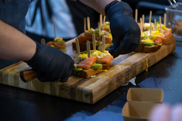 Preparing a delicious salmon appetizer in a modern kitchen setting