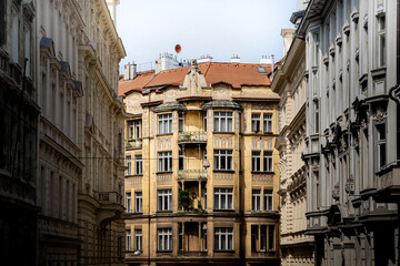 Historic residential building in Prague framed by classical facades