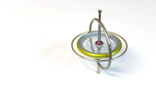 Gyroscope balancing and spinning on white background
