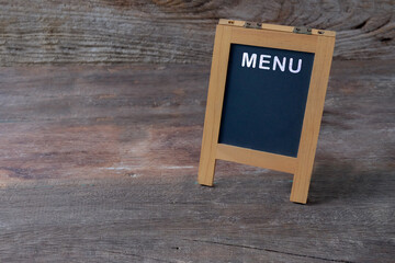 mini blackboard or menu board on the wooden .