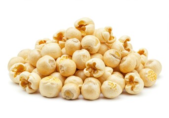 A pile of plain popcorn kernels isolated on white background, ready for a movie night