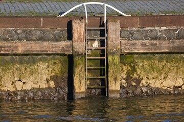 Quay water side old ladder in the docks