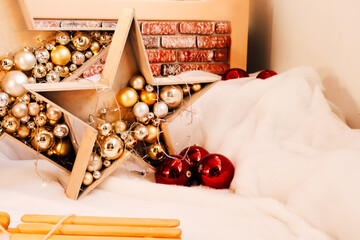 Festive holiday decorations featuring a star filled with ornaments and a cozy winter ambiance