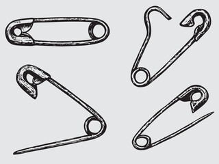 Halftone stipple elements set. Safety pins set with grunge dotted texture for design, punk symbol. Retro photocopy vector illustration isolated