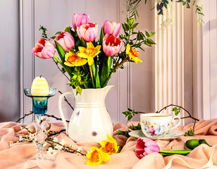 Spring still life with a beautiful bouquet of pink tulips, yellow daffodils in a white vintage jug,...
