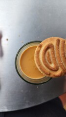 butter cookies with tea in a glass cup