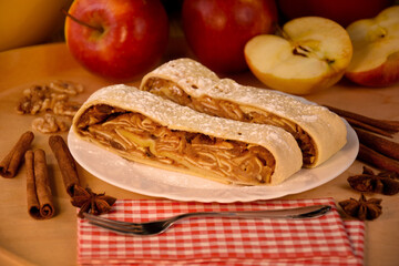 Apple strudel with cinnamon, apples and nuts on a wooden table stock photo images. Traditional...