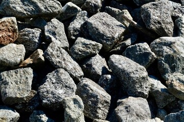 Gray stones blurred for background.