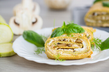 Zucchini roll on a light wooden background