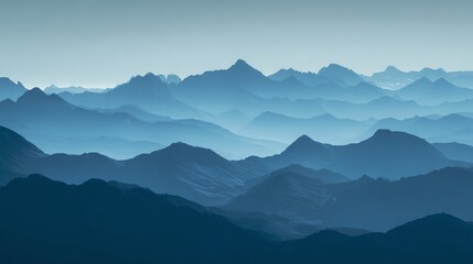 A serene layered mountain range with blue hues fades into the distance under a clear sky, creating a tranquil and vast landscape scene.