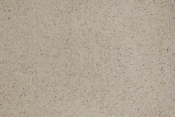 Abstract background. Texture of light beige concrete or stone with small color inclusions. Neutral background for various projects