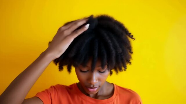 African girl proudly flaunts her beautiful curly hair in vibrant setting