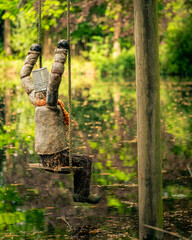 Lonly puppet on a swing